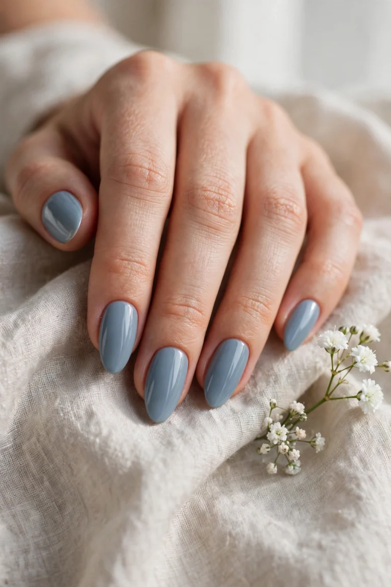 Dusty blue manicure on elegant nails